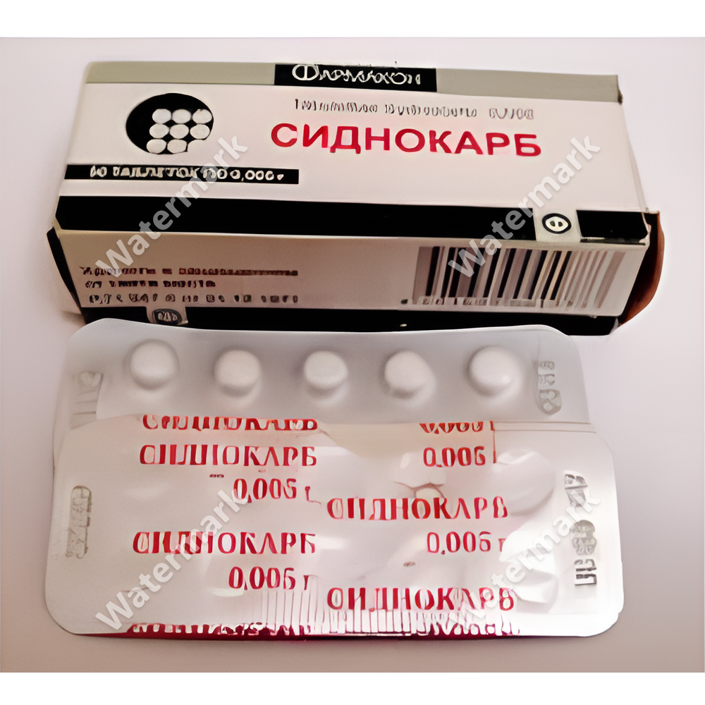 Упаковка отечественного психостимулятора Сиднокарб (Мезокарб) в дозировке 5 мг. На фото представлена бело-серая картонная коробка от производителя 'Фармстандарт' и блистер с таблетками. На фольге блистера красным шрифтом нанесено название препарата и дозировка 0,005 г